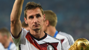 Miroslav Klose with the 2014 World Cup trophy.